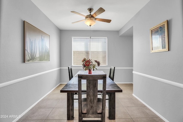 dining area with ceiling fan and light tile patterned floors