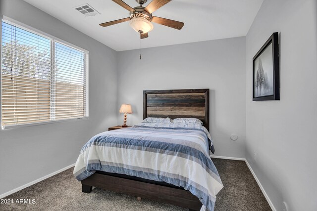 bedroom with ceiling fan and carpet floors