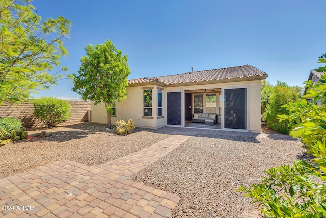 back of house featuring a patio