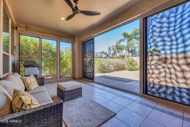 sunroom / solarium with ceiling fan and a wealth of natural light