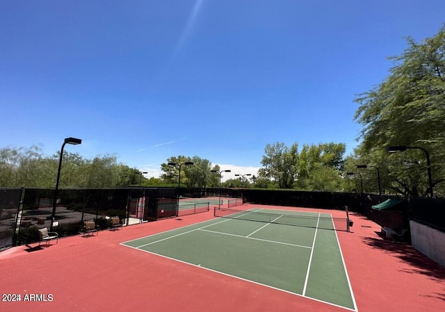 view of sport court with basketball hoop