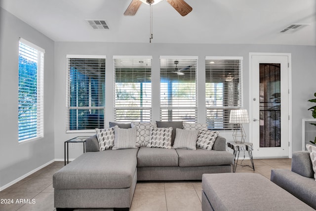 tiled living room with ceiling fan