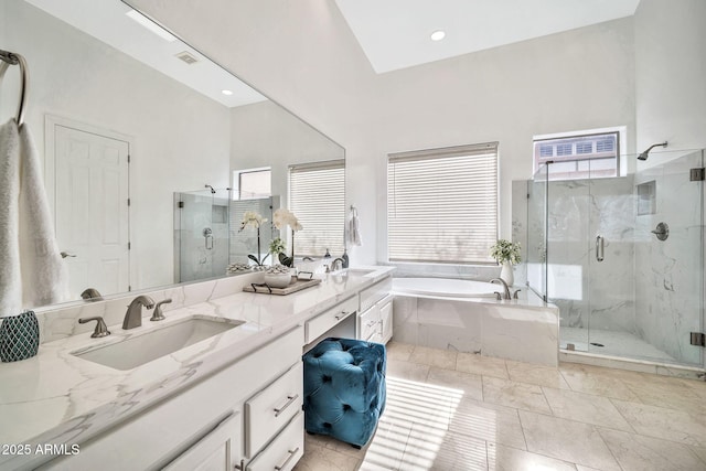 bathroom with a healthy amount of sunlight, a marble finish shower, and a sink