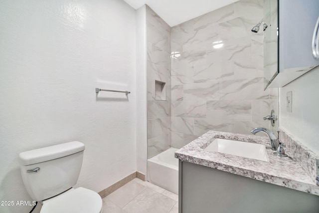 full bath featuring tile patterned flooring, toilet, vanity, baseboards, and washtub / shower combination