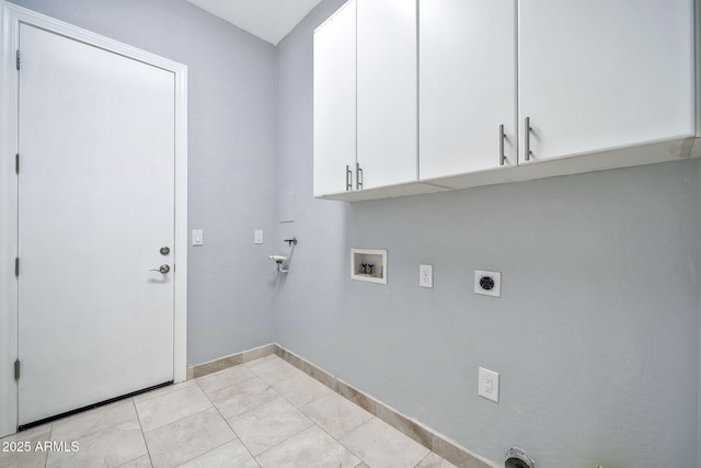 washroom featuring washer hookup, cabinet space, electric dryer hookup, and baseboards