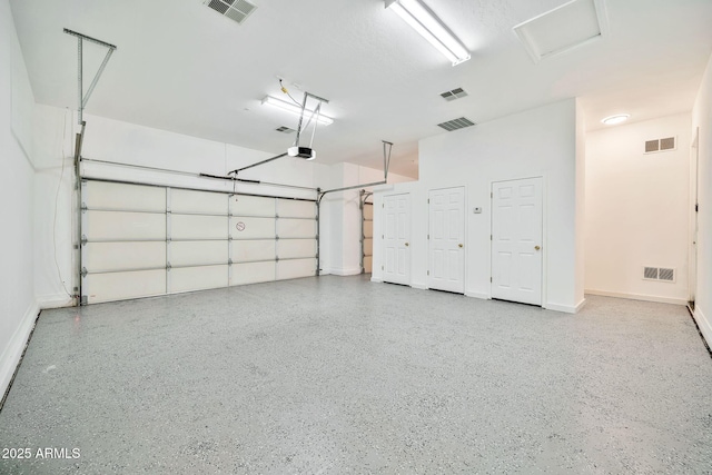 garage with visible vents and baseboards