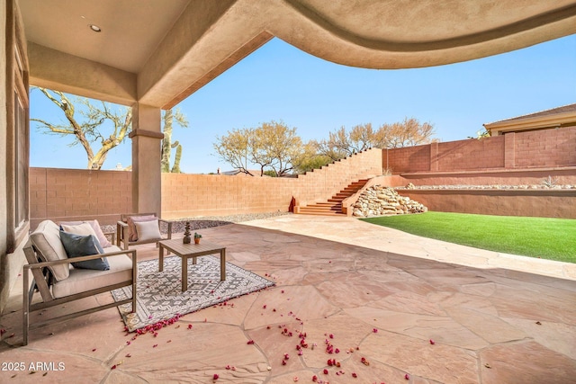 view of patio with stairs, an outdoor hangout area, and a fenced backyard