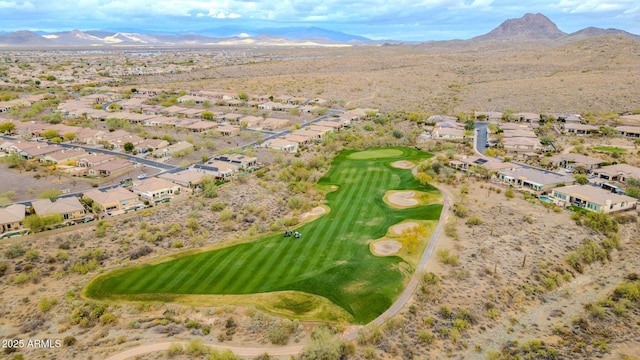 birds eye view of property featuring view of golf course, a residential view, and a mountain view