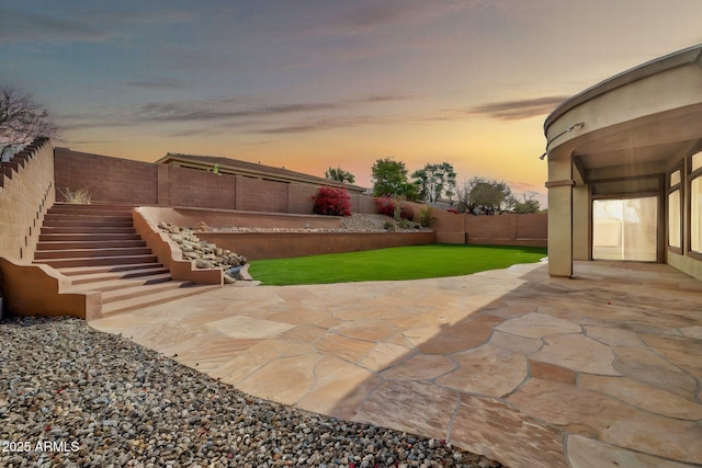 view of patio / terrace featuring a fenced backyard and stairway