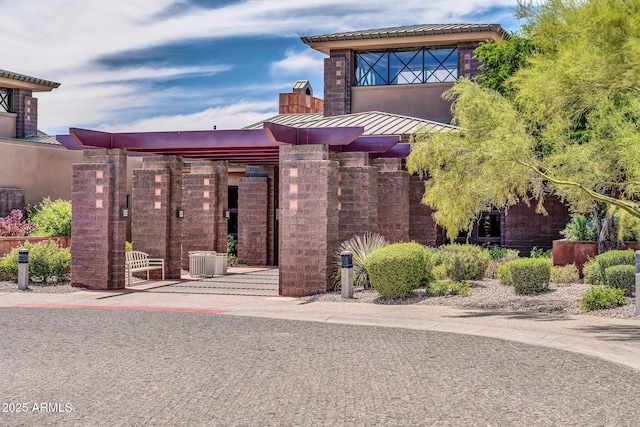 exterior space featuring a standing seam roof and metal roof