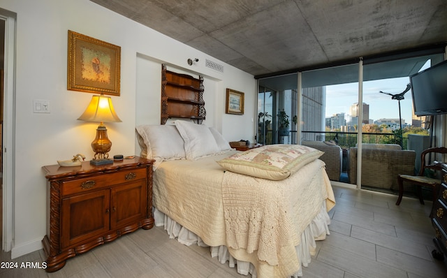 bedroom featuring a wall of windows