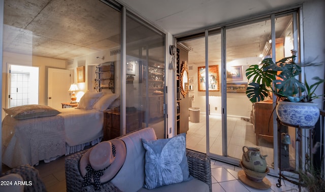 bedroom featuring light tile patterned floors