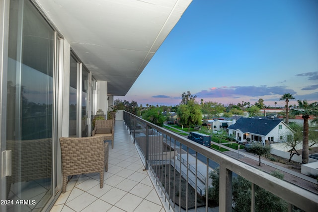 view of balcony at dusk