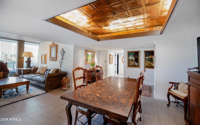 dining area with a tray ceiling