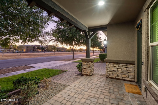 view of patio terrace at dusk