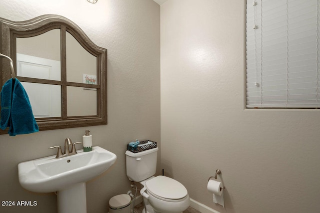 bathroom with toilet and sink