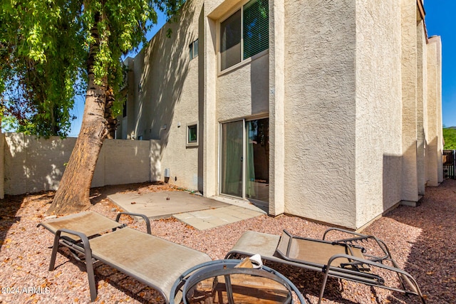 rear view of house featuring a patio