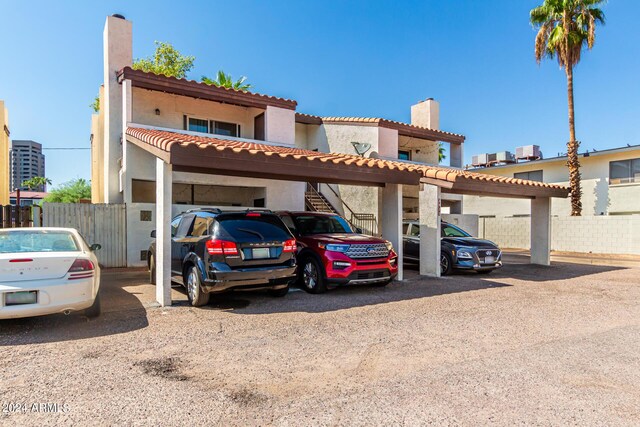 view of front of home with a carport