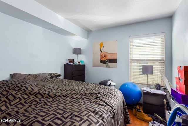 bedroom with wood-type flooring