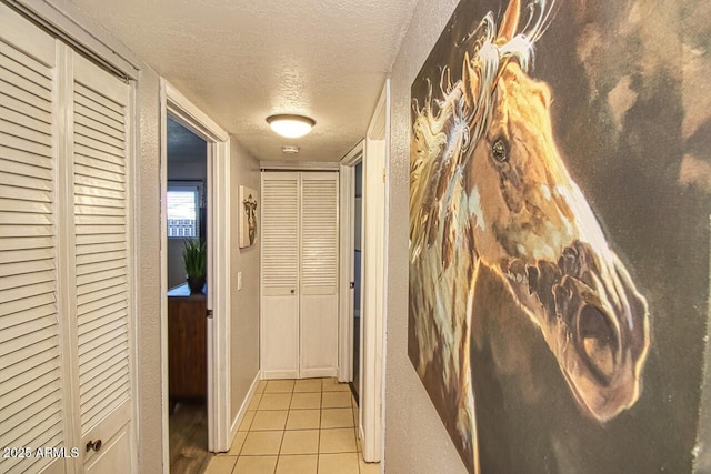 4905 E Horseshoe Ln, Cottonwood, AZ 86326 - hallway with light tile patterned floors and a textured ceiling