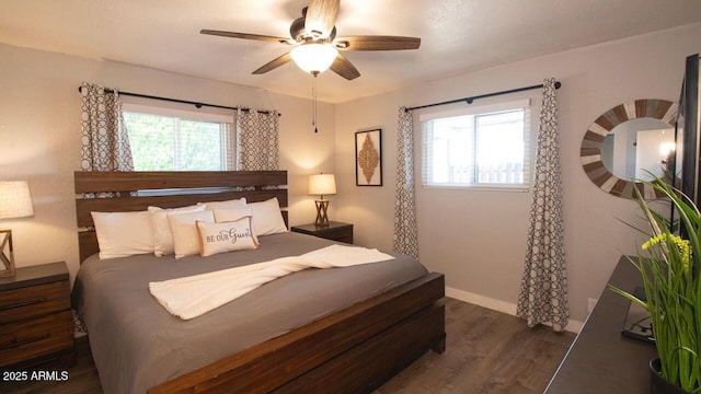 4905 E Horseshoe Ln, Cottonwood, AZ 86326 - bedroom with wood finished floors, baseboards, a ceiling fan, and multiple windows