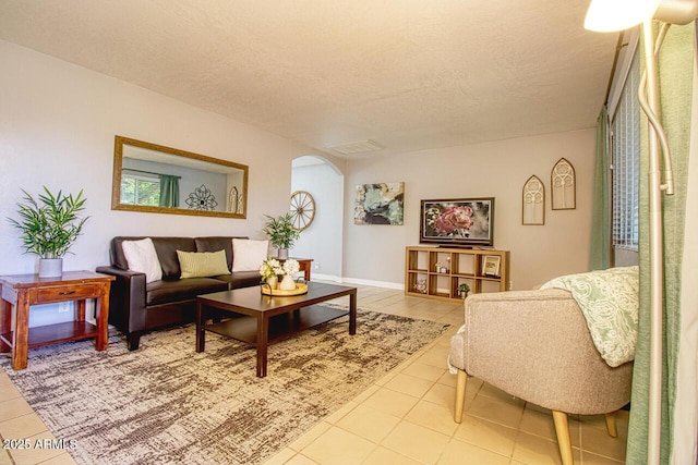 4905 E Horseshoe Ln, Cottonwood, AZ 86326 - living area with light tile patterned floors, arched walkways, and a textured ceiling