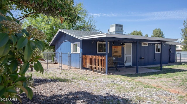 4905 E Horseshoe Ln, Cottonwood, AZ 86326 - rear view of house with a gate, fence, central AC, and a patio