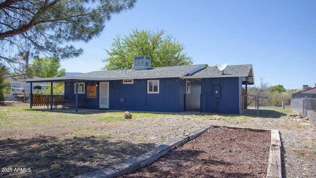 4905 E Horseshoe Ln, Cottonwood, AZ 86326 - rear view of property with roof with shingles, a patio area, and fence