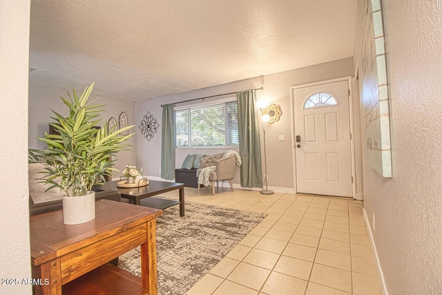 4905 E Horseshoe Ln, Cottonwood, AZ 86326 - entryway featuring baseboards, a textured ceiling, light tile patterned flooring, and a textured wall
