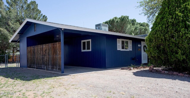 4905 E Horseshoe Ln, Cottonwood, AZ 86326 - view of home's exterior with fence, a carport, and central air condition unit