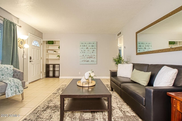 4905 E Horseshoe Ln, Cottonwood, AZ 86326 - living room featuring a textured ceiling, visible vents, built in features, and tile patterned flooring