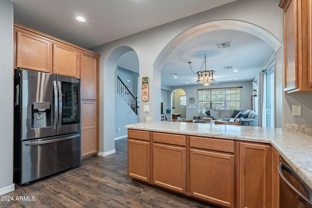 kitchen featuring a chandelier, dark hardwood / wood-style flooring, and stainless steel appliances