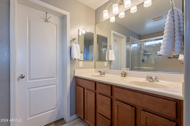 bathroom with vanity and walk in shower