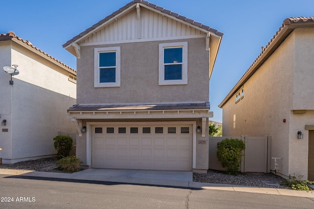 front facade with a garage