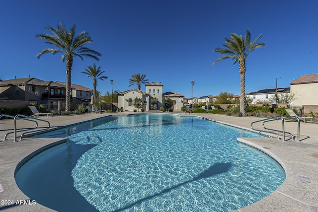 view of swimming pool with a patio