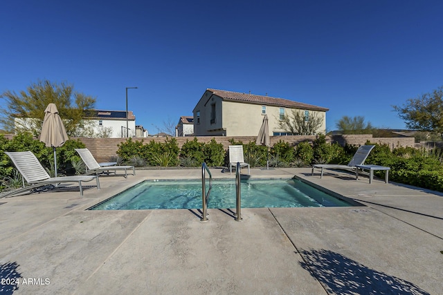 view of swimming pool featuring a patio