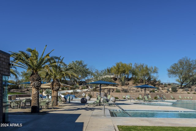 view of community featuring a patio area and a pool