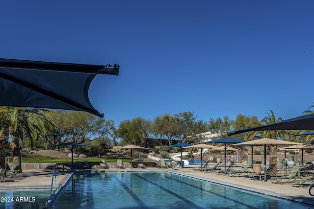 view of swimming pool with a patio