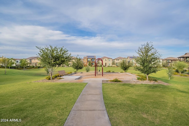 view of community with a playground and a yard