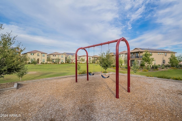 view of jungle gym featuring a lawn