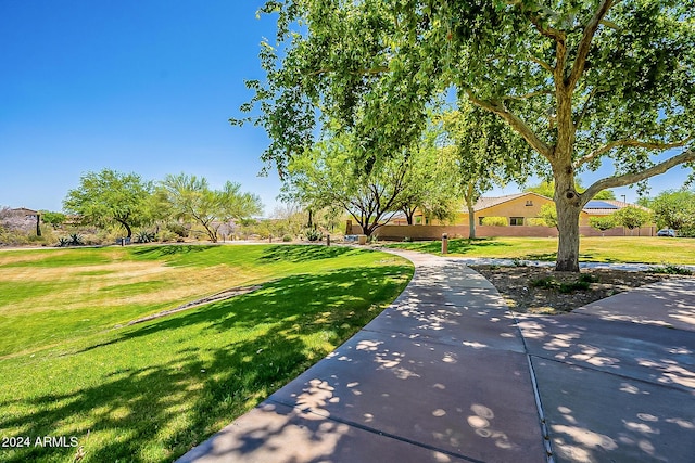 view of home's community featuring a lawn