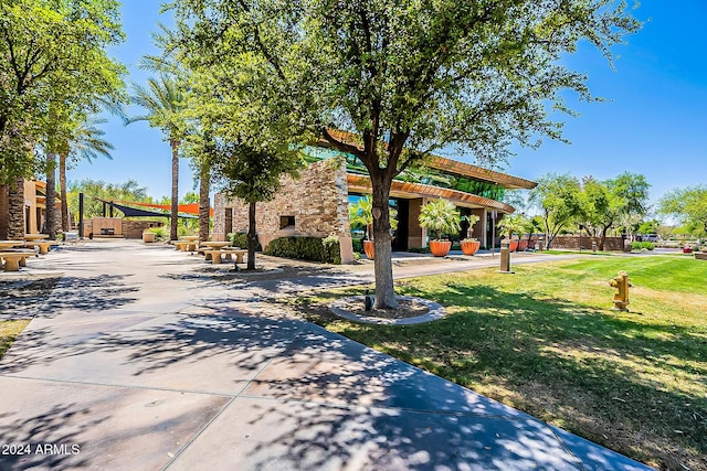 view of property's community with a lawn