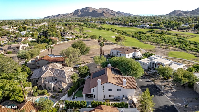 birds eye view of property with a mountain view