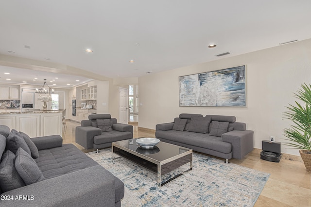 living room with an inviting chandelier