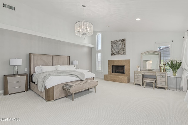 bedroom featuring an inviting chandelier, high vaulted ceiling, and carpet flooring