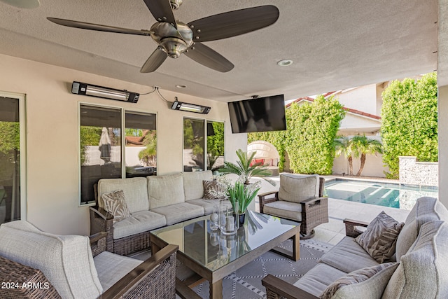 view of patio featuring an outdoor hangout area and ceiling fan