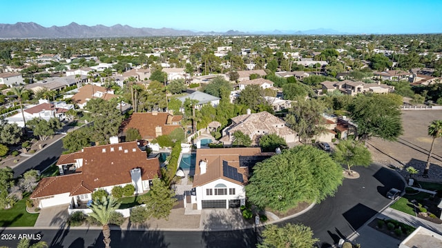 birds eye view of property featuring a mountain view