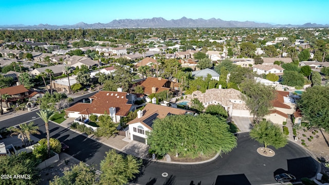 birds eye view of property featuring a mountain view