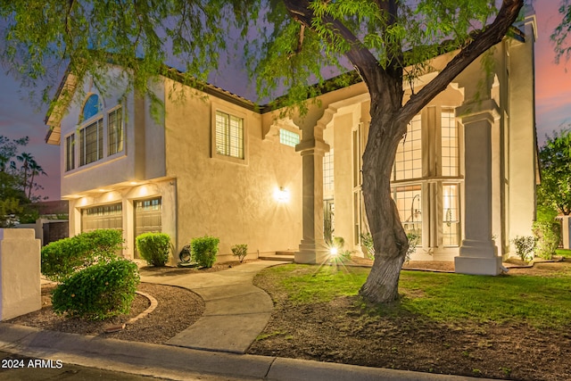 mediterranean / spanish home with a garage