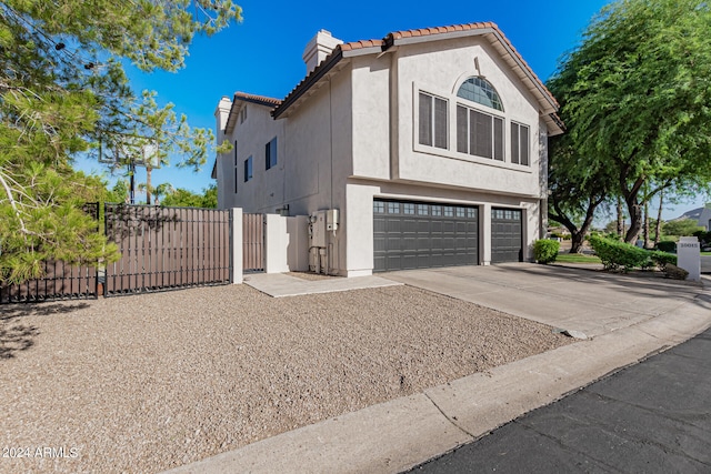 view of side of property featuring a garage